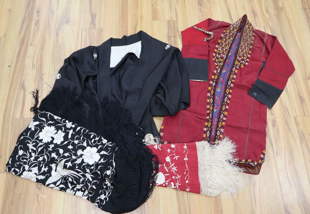 A black shawl with white embroidery, a smaller embroidered shawl, a kimono and a claret embroidered jacket